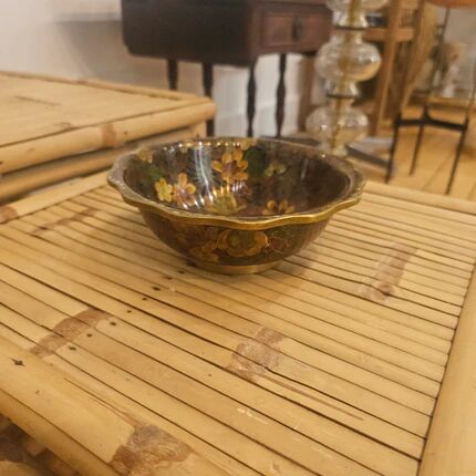 Vintage Asian brass bowl with floral decoration.