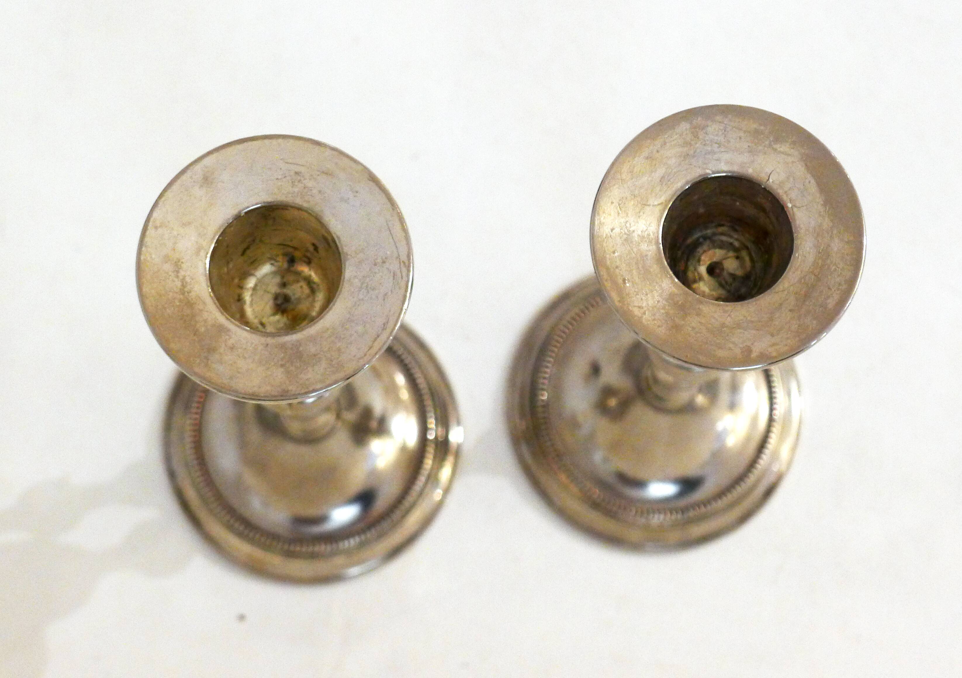 Pair of metal candle holders