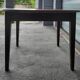 Antique round farmhouse table with drop-leaf doors in solid pegged wood