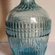 Blue glass carafe with vintage pegs