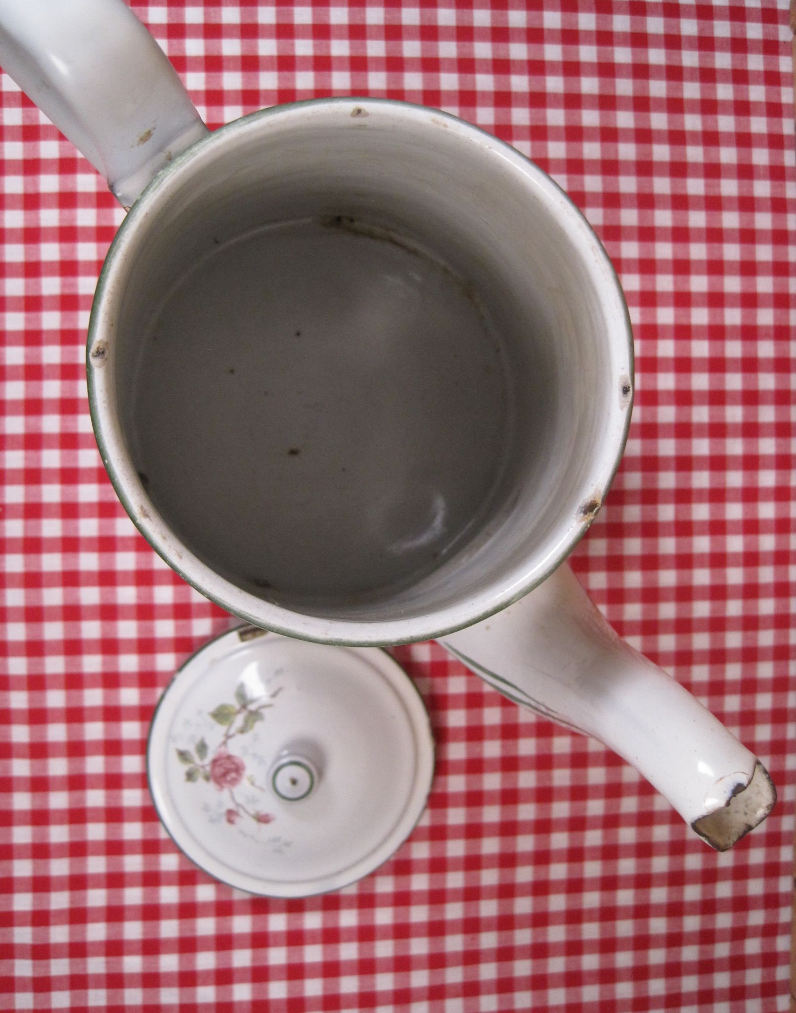 Old coffee maker in enamelled sheet metal brand bb 1900s , decoration of roses , kitchen utensils
