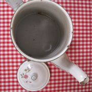 Old coffee maker in enamelled sheet metal brand bb 1900s , decoration of roses , kitchen utensils