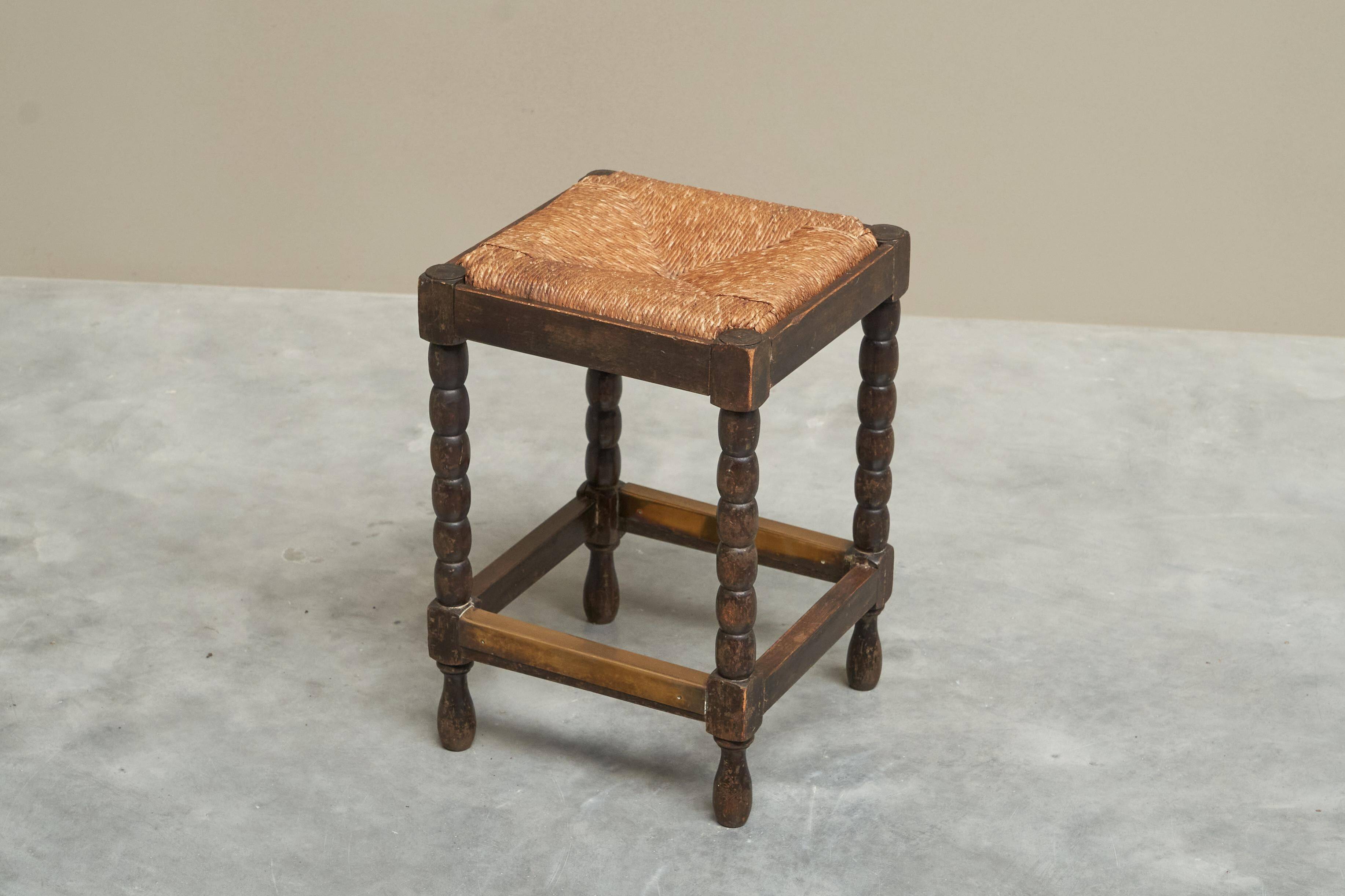 Solid oak stool, straw and brass from the 1920s.