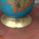 Vintage turquoise brass champagne bucket with grape decoration.