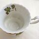Tea cup, solitary service, naturalistic decoration, in Limoges porcelain.