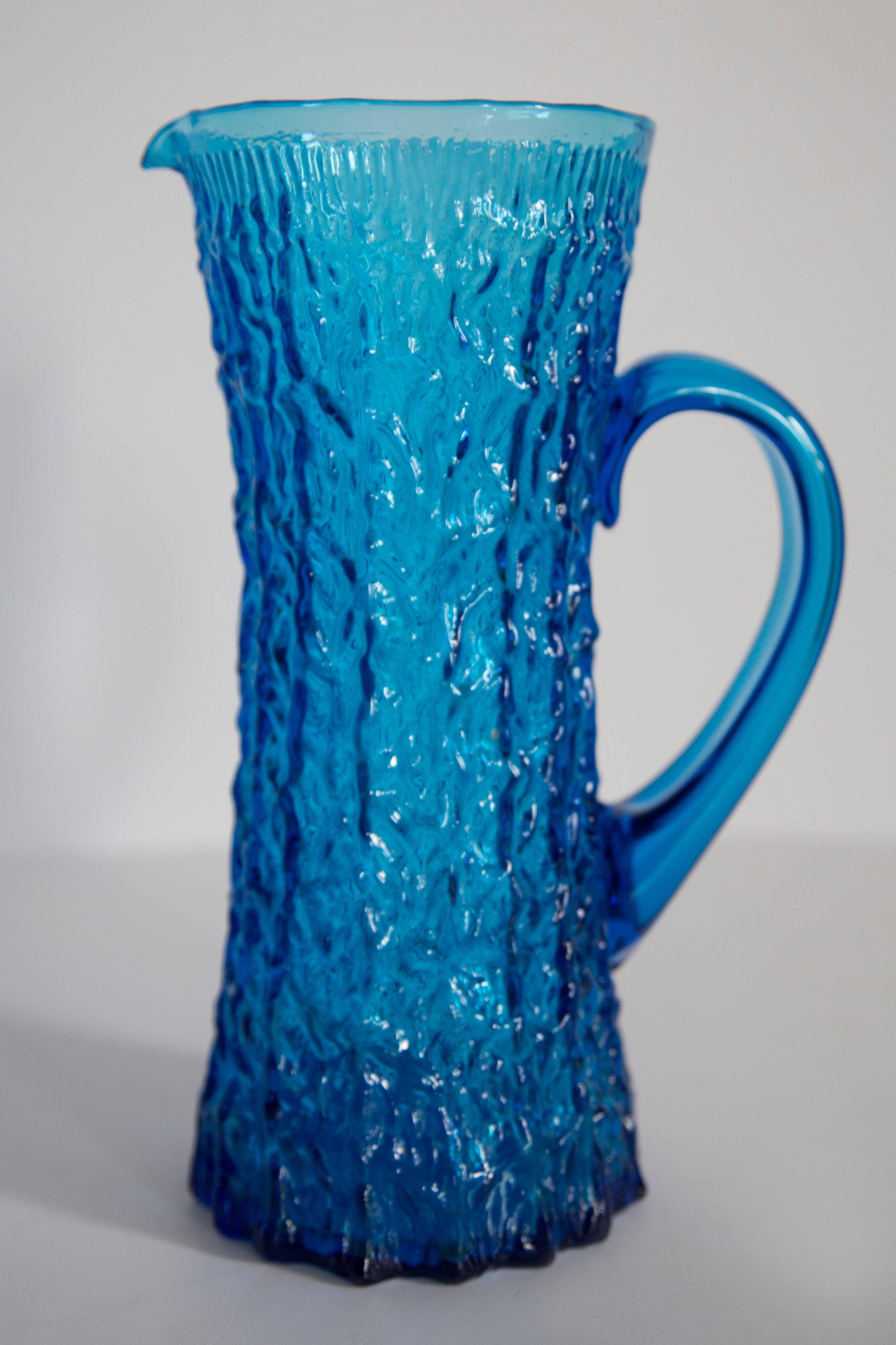 Blue glass water or juice pitcher from the mid-20th century.
