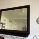 Beveled vintage mirror in painted wood 95x68cm