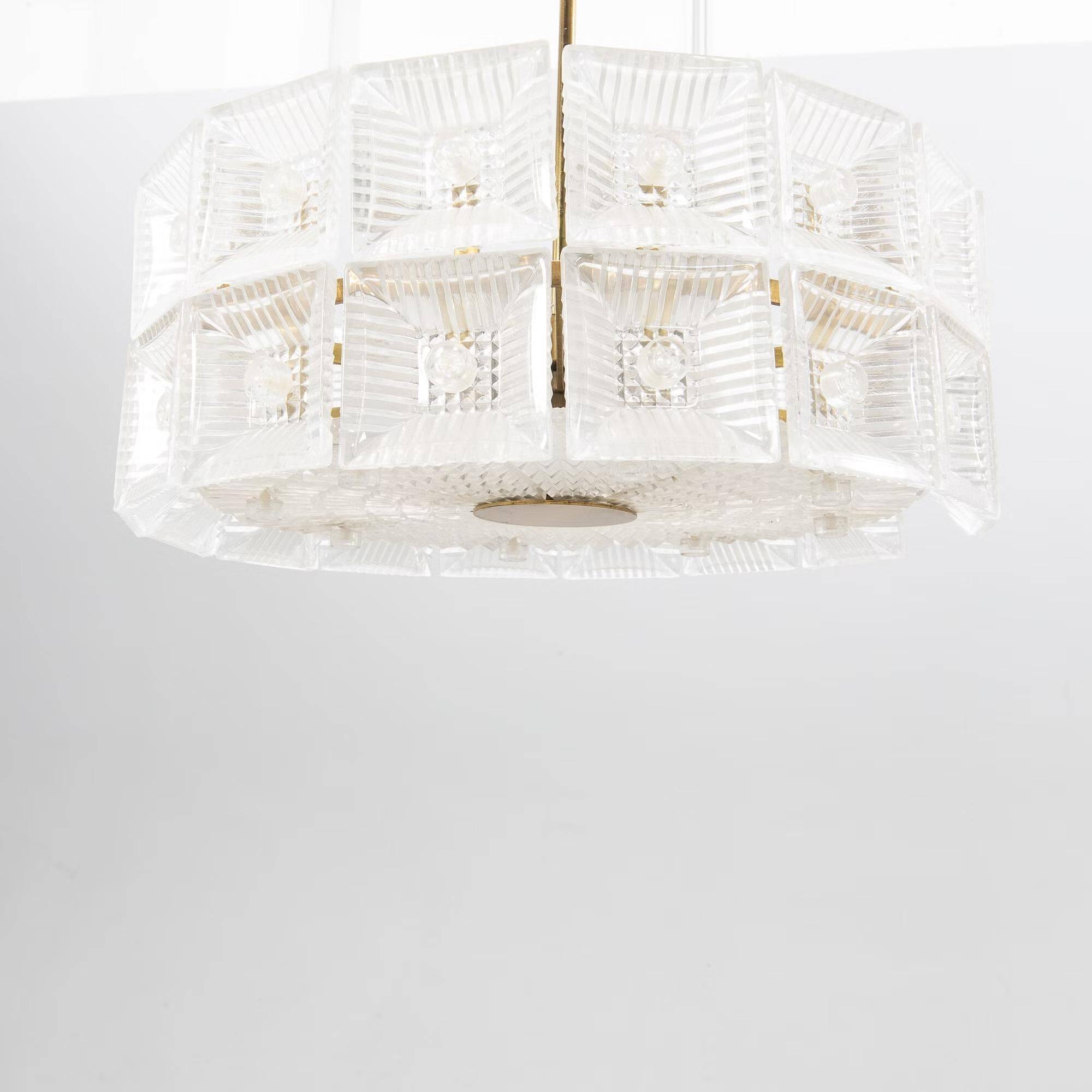 Suspended glass and brass lamp by Carl Fagerlund for Orrefors, Sweden, 1960.