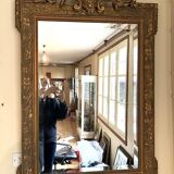 Large rectangular beveled mirror with gold stucco