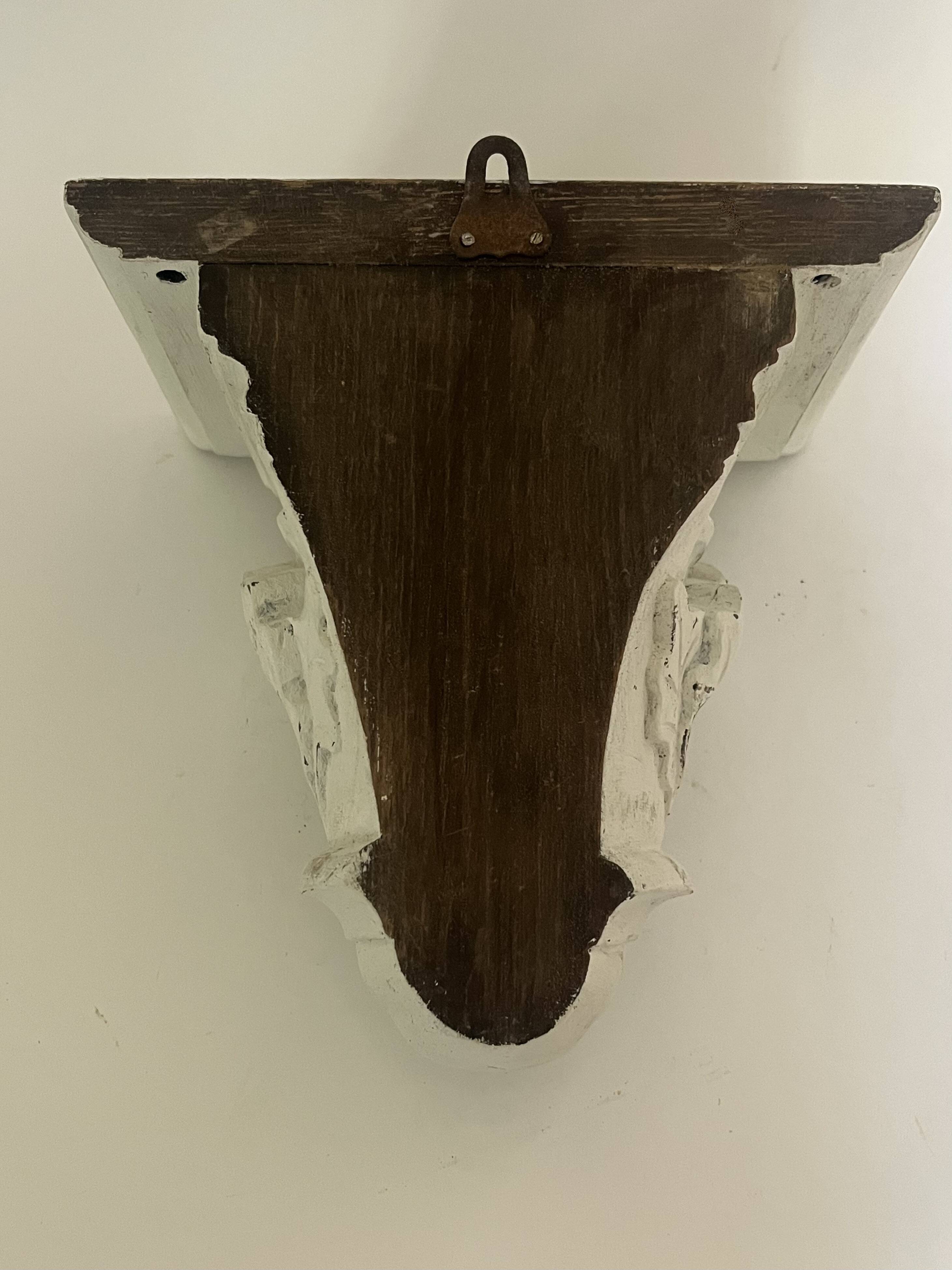 Carved wooden wall bracket