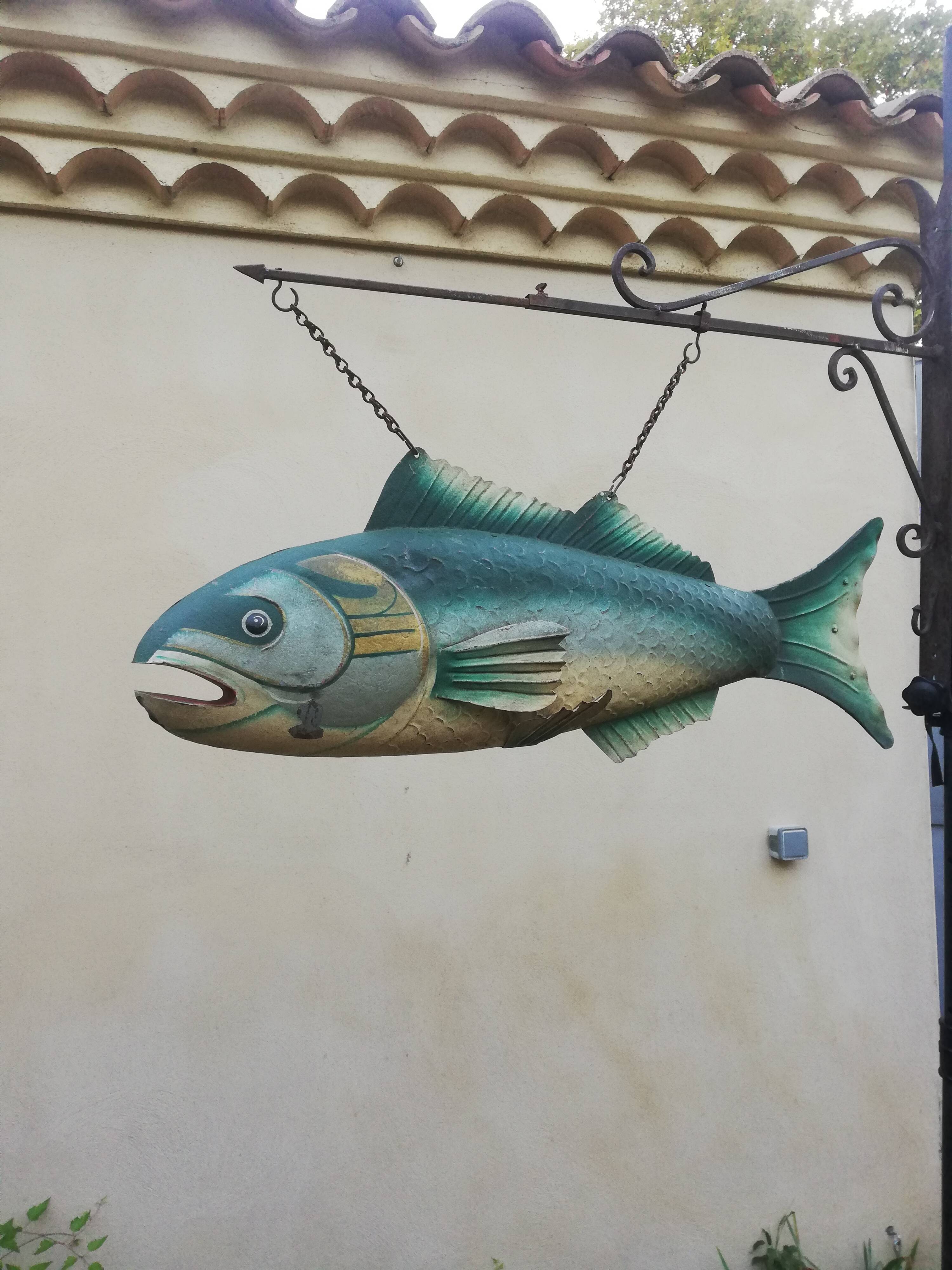 Panel depicting a fish in sheet metal