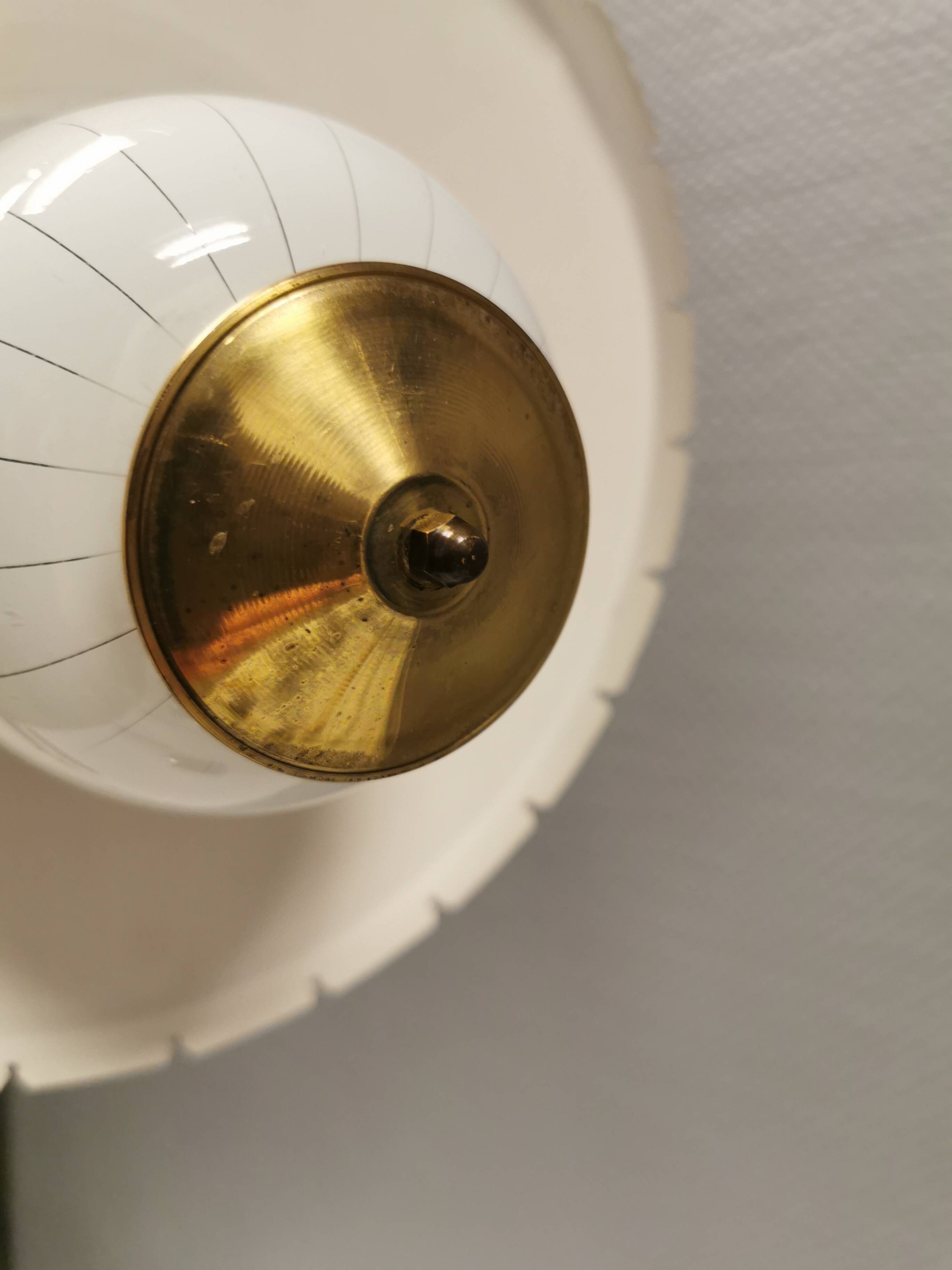 Hanging lamp in glass with black lacquered metal shade and brass base.