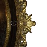 Miroir ovale en bois doré