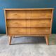 Vintage chest of drawers with wing drawers