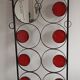 Coat racks, hats and umbrellas wall-mounted in wrought iron.