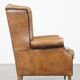 Sheep leather wingback chair finished with black piping
