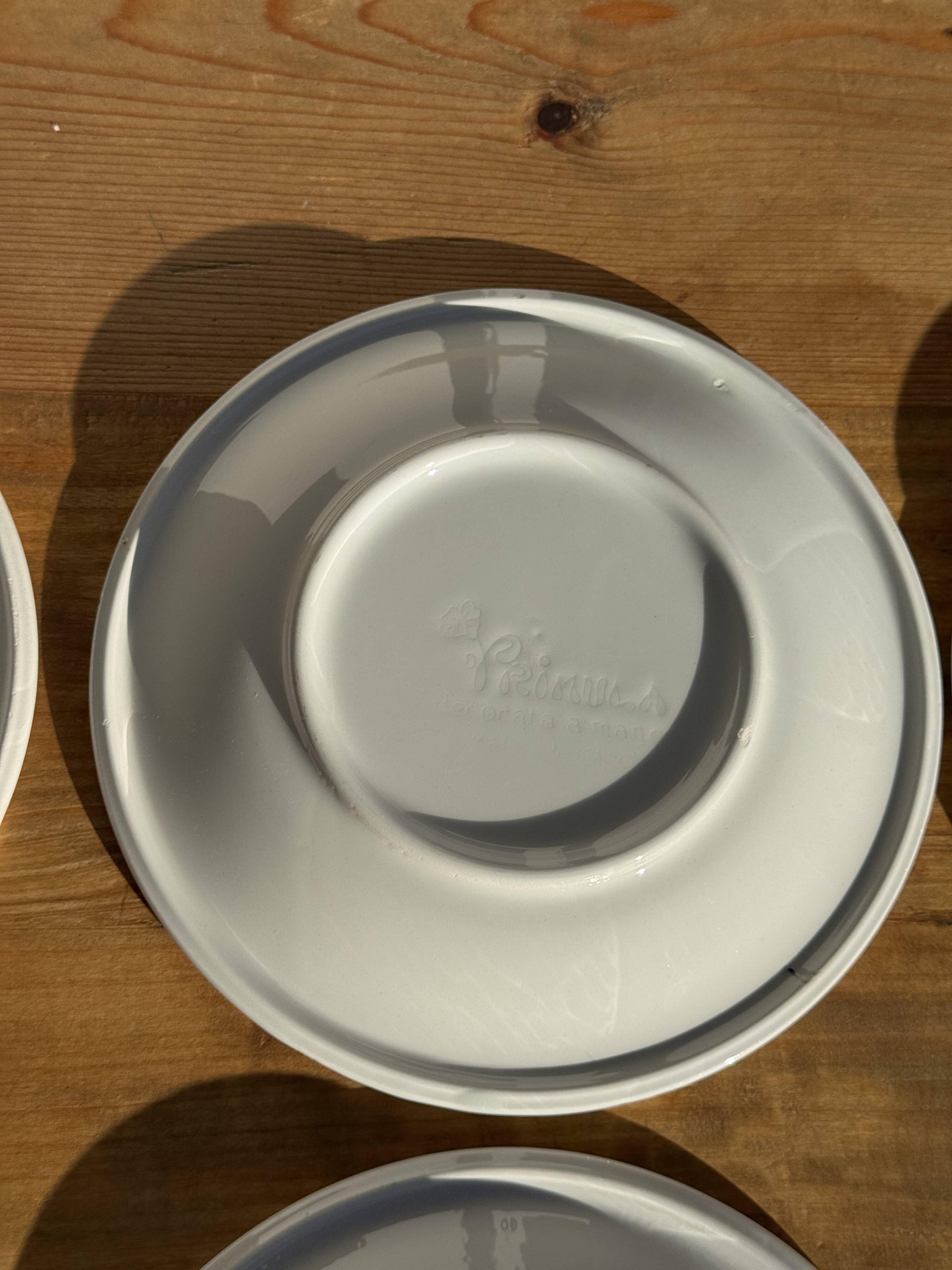 Set of 9 small Italian dessert plates Primula with red and green trim.
