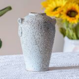 Old foam-glazed terracotta vase