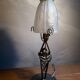 Black wrought iron lamp with gold patina