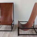 Pair of vintage armchairs in stretched leather and metal structure