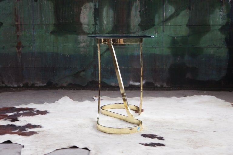 Brass ribbon console table Design Institute of America
