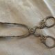 Sugar tongs or sweets in silver metal