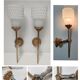Pair of vintage patinated golden metal hand sconces