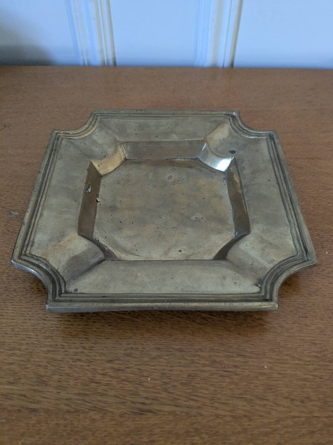 Brass pocket emptier