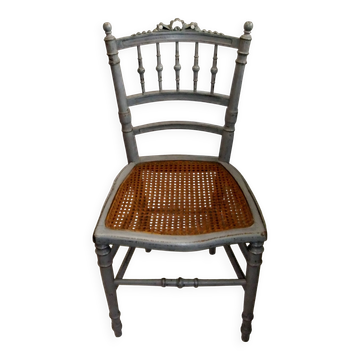 Antique Louis XVI style chair with grey cane.