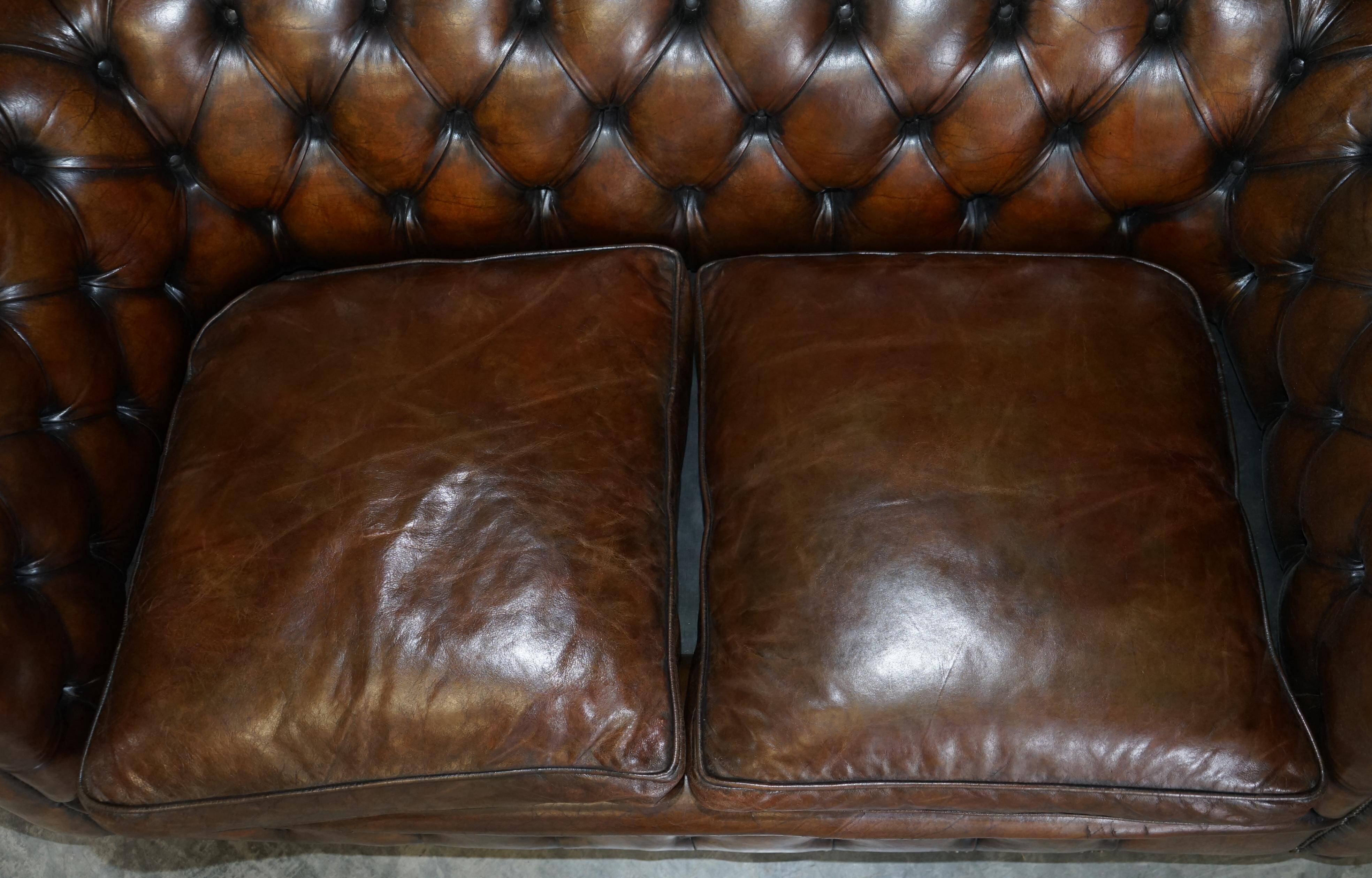 Restored leather Chesterfield sofa, walnut legs.