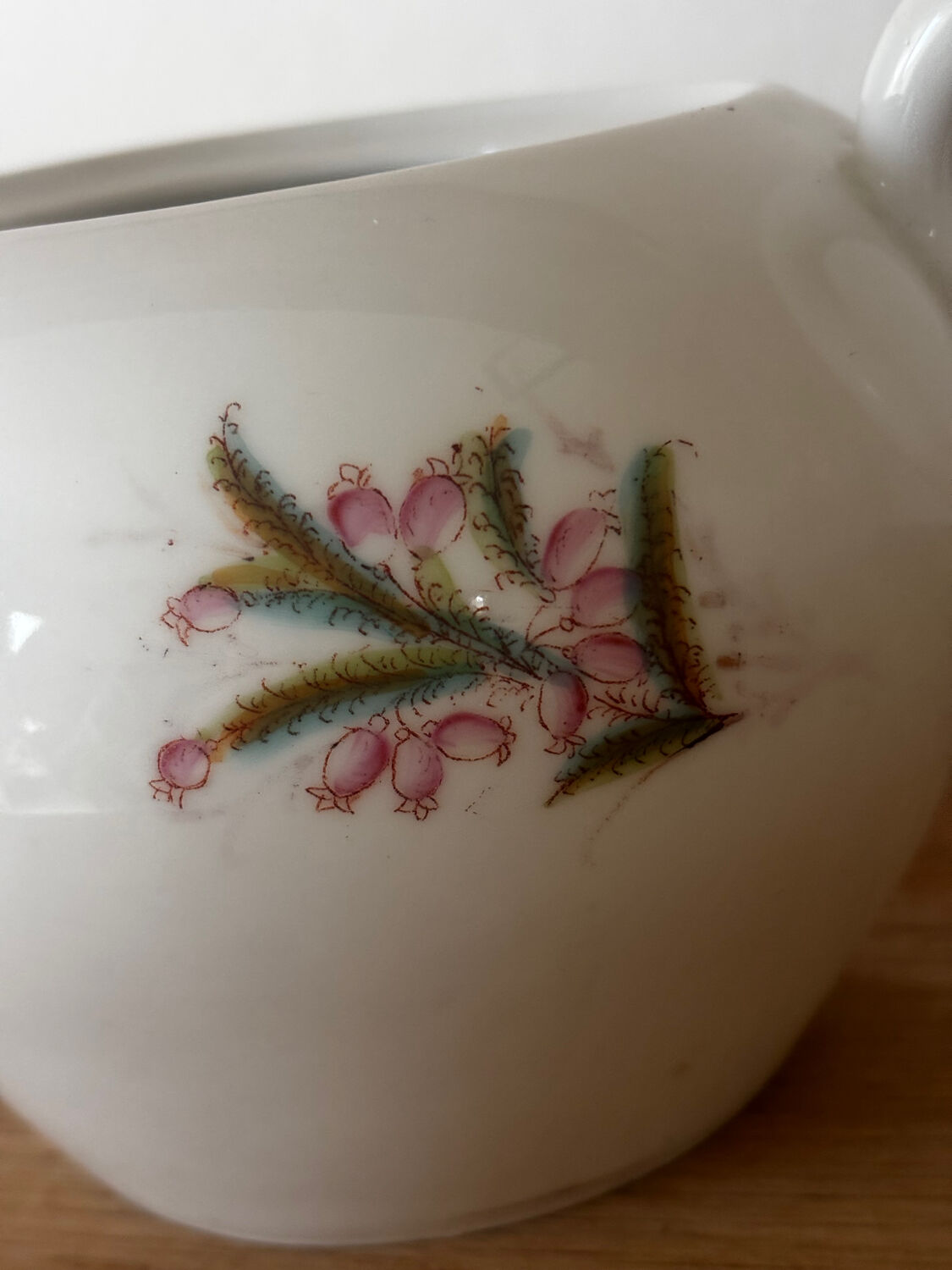 Beautiful vintage porcelain sugar bowl with a floral pattern.