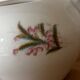 Beautiful vintage porcelain sugar bowl with a floral pattern.