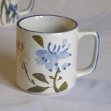 Set of 4 stoneware cups/mugs with blue floral designs, made in China.