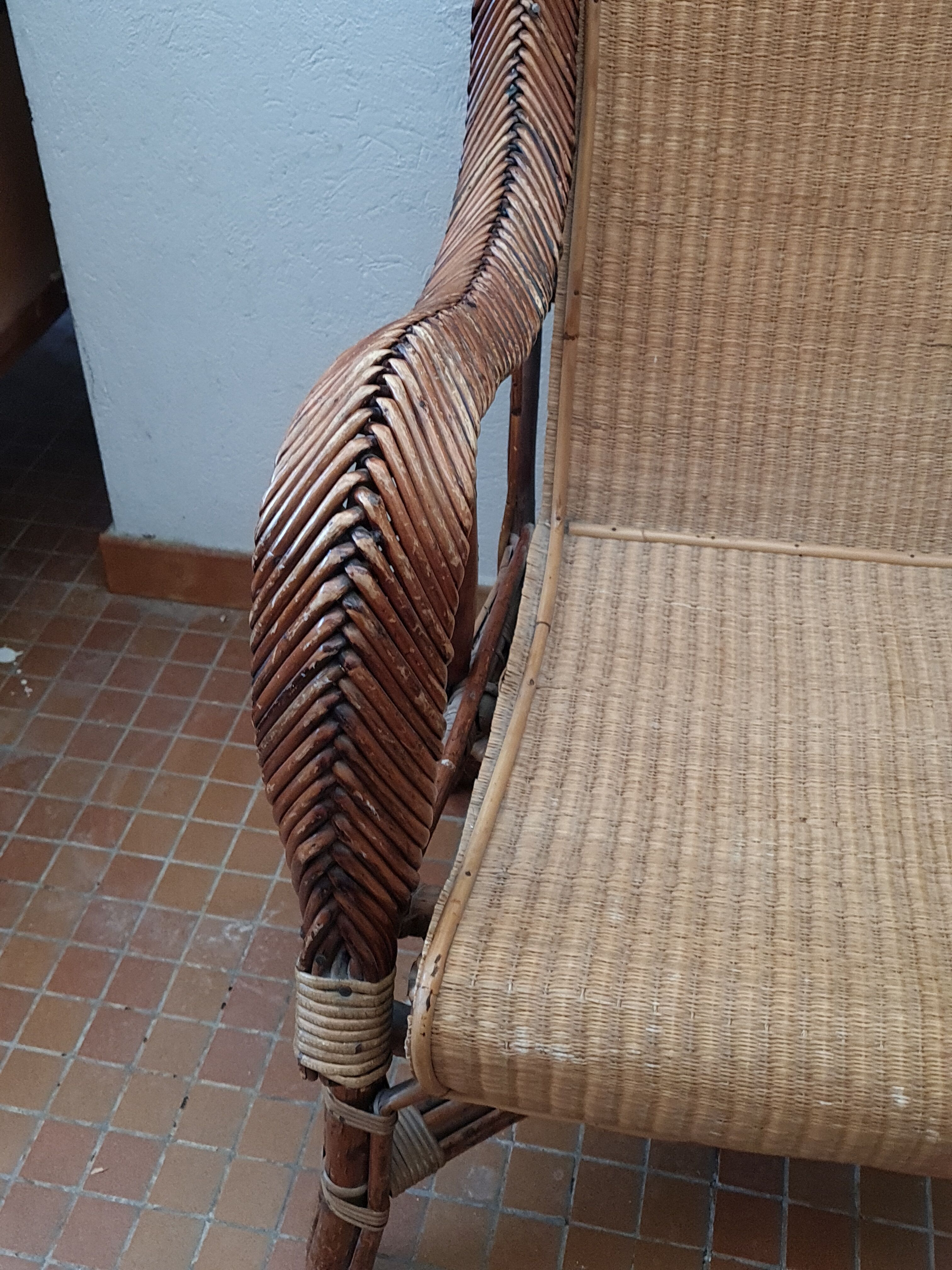 Old rattan armchair circa 1900-1930