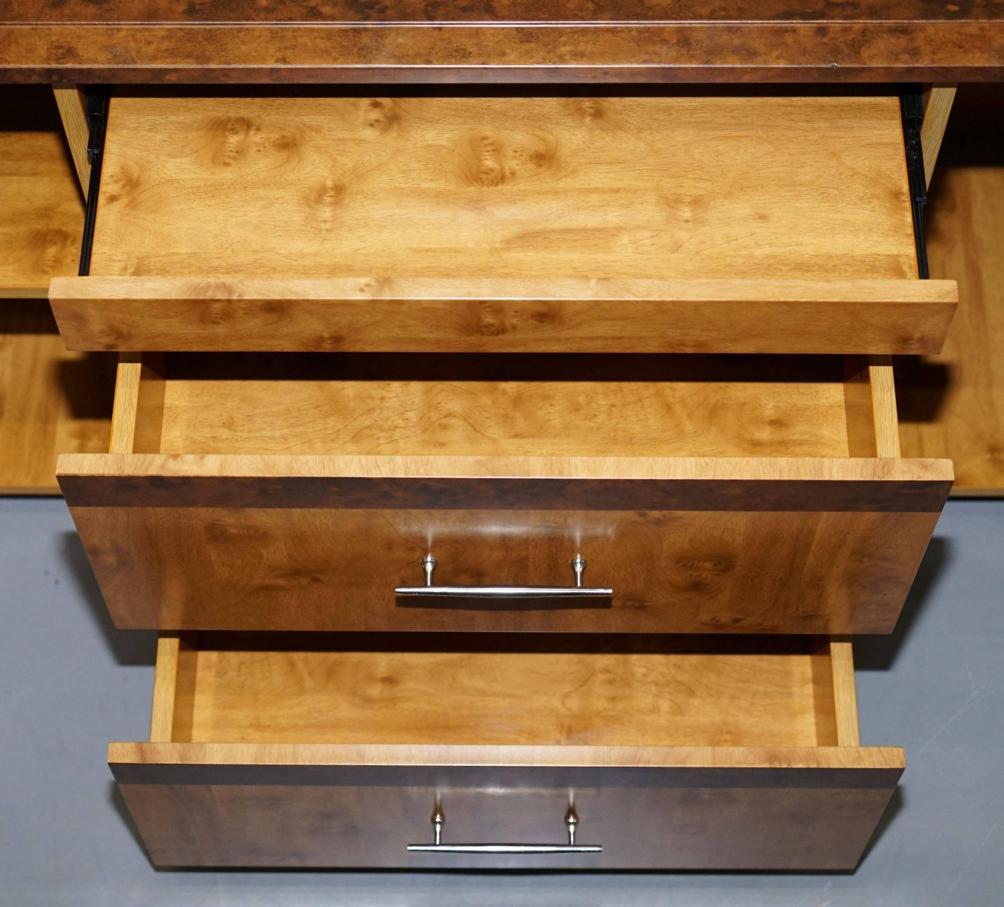 Walnut Burr buffet with drawers and wheels, part of a set.