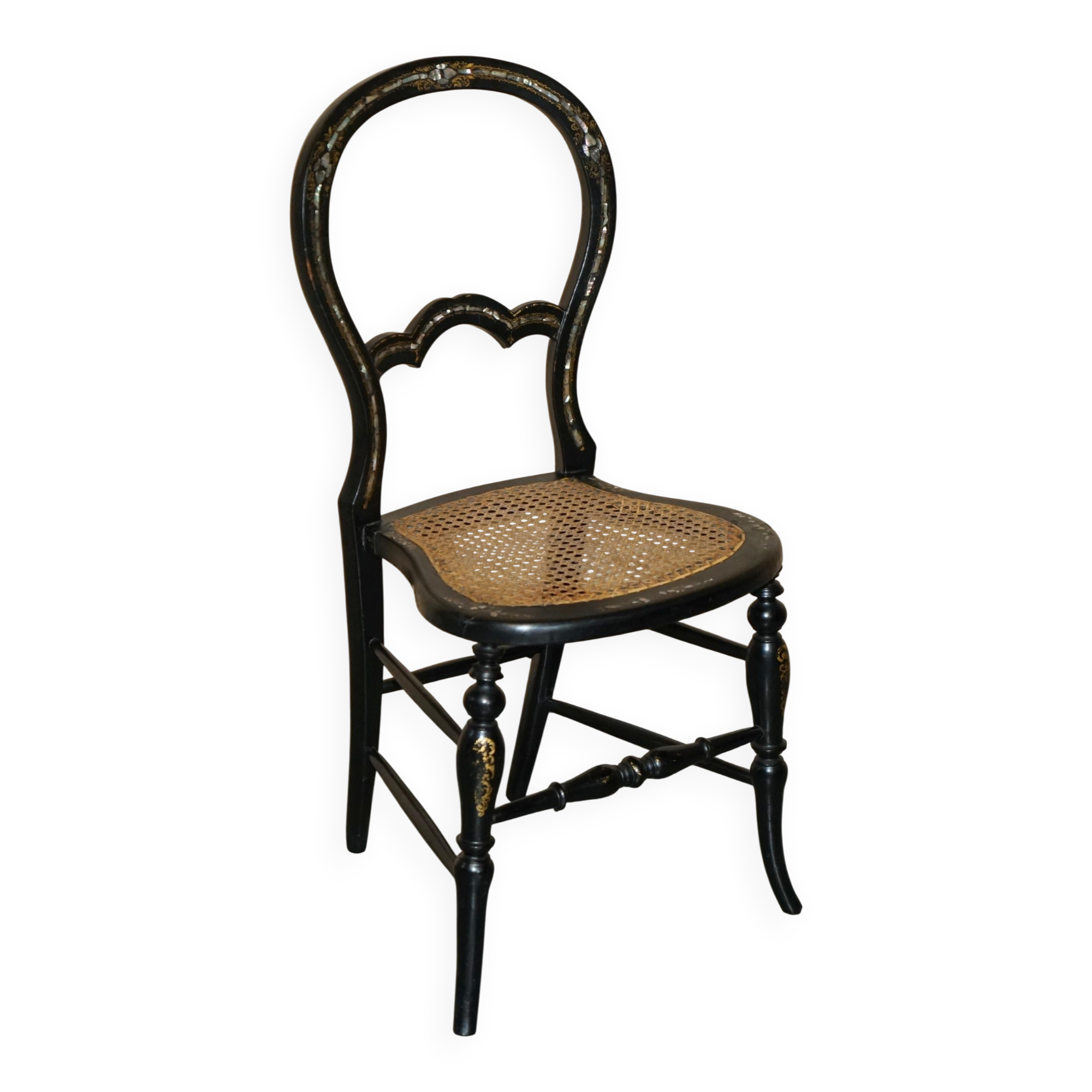 Four antique Regency bergère chairs with mother-of-pearl inlay.