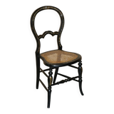 Four antique Regency bergère chairs with mother-of-pearl inlay.