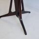 Mid-century modern round dining table in marble and ebony wood.