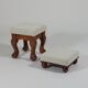 Unique sculpted stools, freshly upholstered and exquisite.
