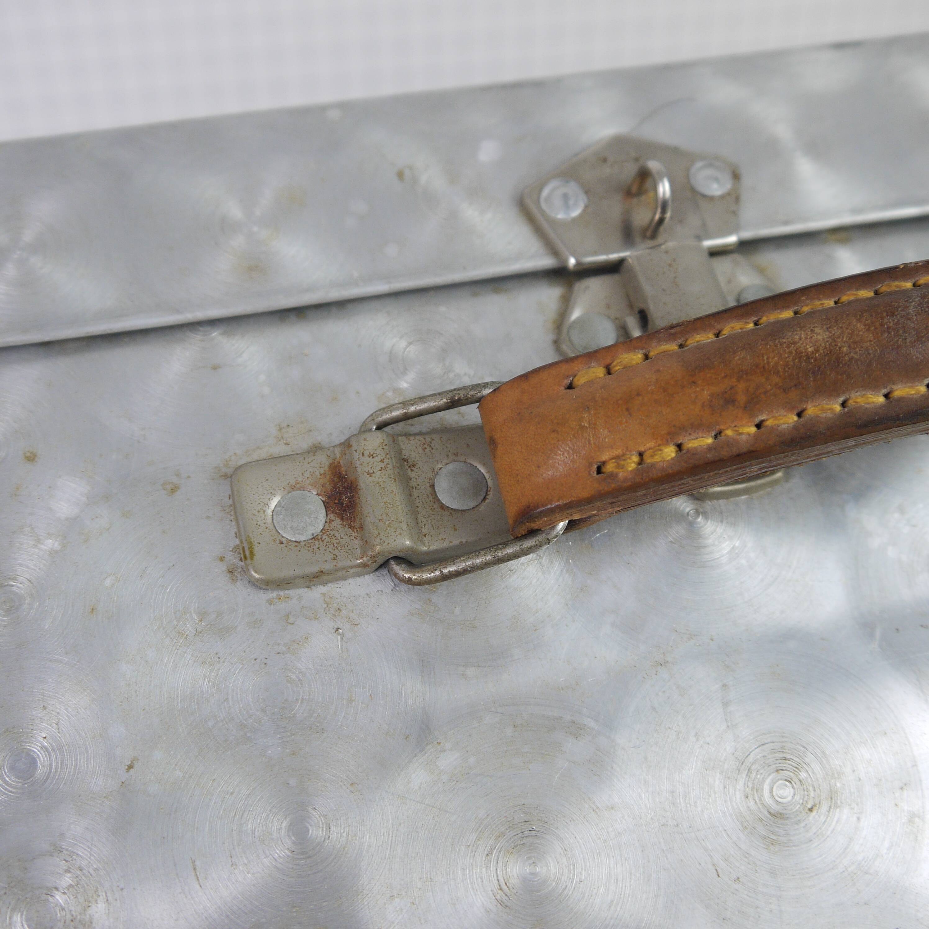 Metal case and leather handle