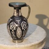 A jar of water pitcher made of tamgroute pottery handmade and adorned with bones.