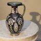A jar of water pitcher made of tamgroute pottery handmade and adorned with bones.