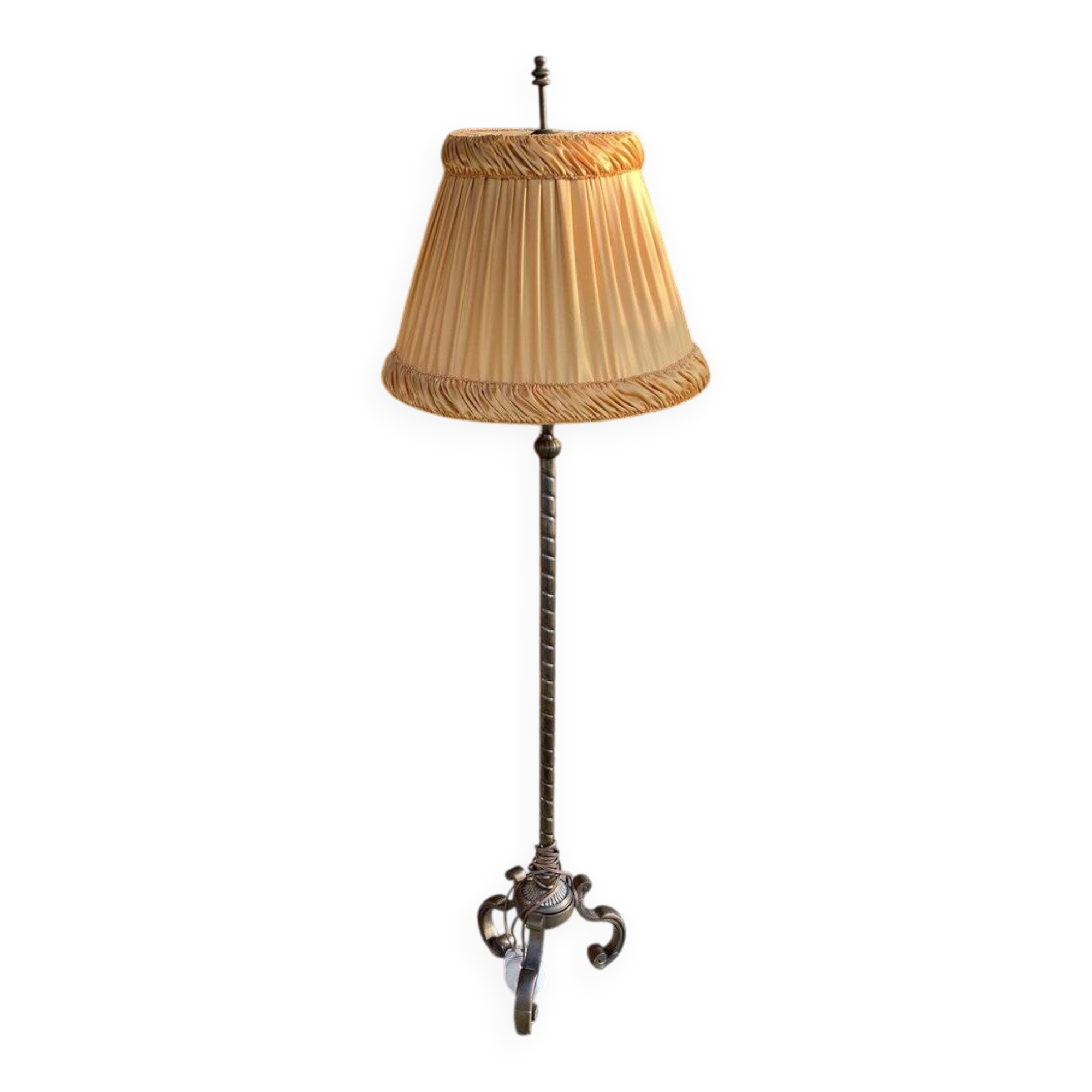 Art Deco floor lamp in bronze metal with a straw yellow fabric shade, twisted shaft, and tripod base.