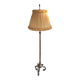Art Deco floor lamp in bronze metal with a straw yellow fabric shade, twisted shaft, and tripod base.