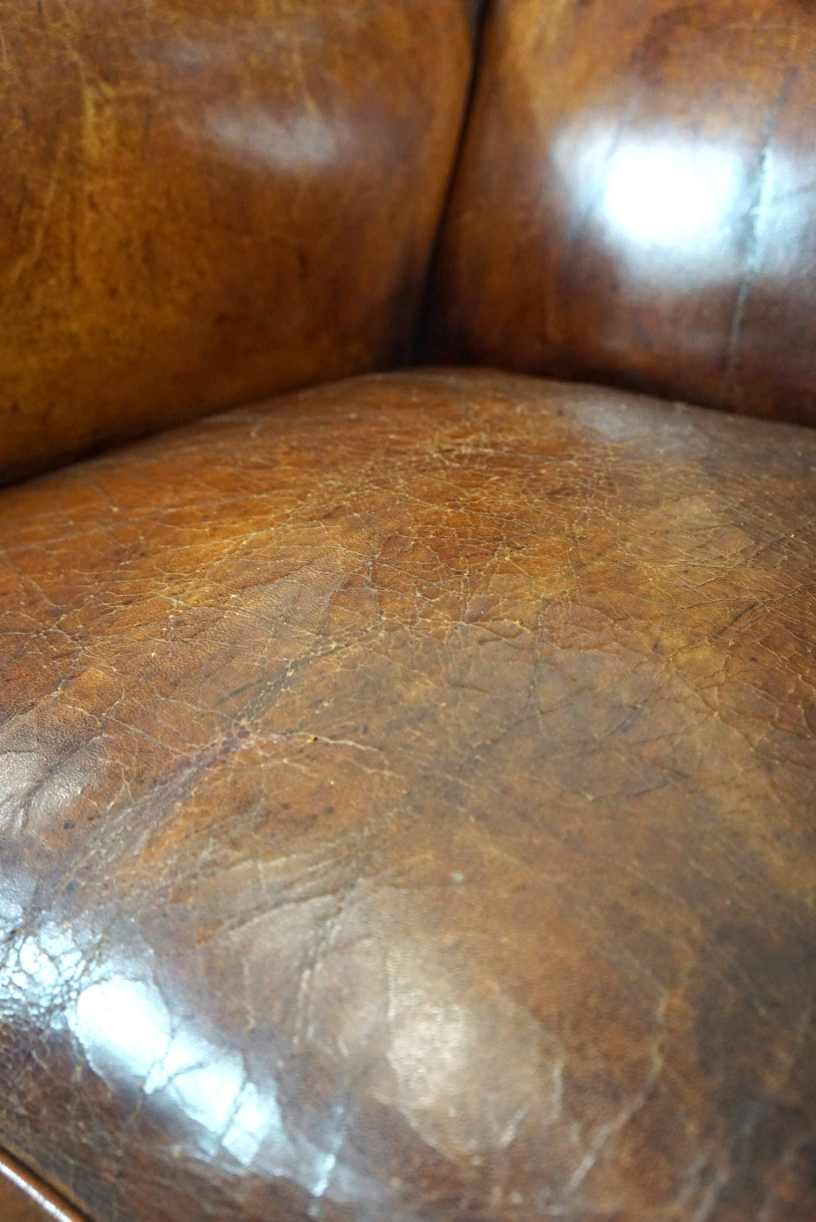 Irresistible old sheep leather wingback armchair with the most beautiful colors