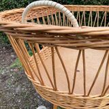 Vintage wicker cradle on casters