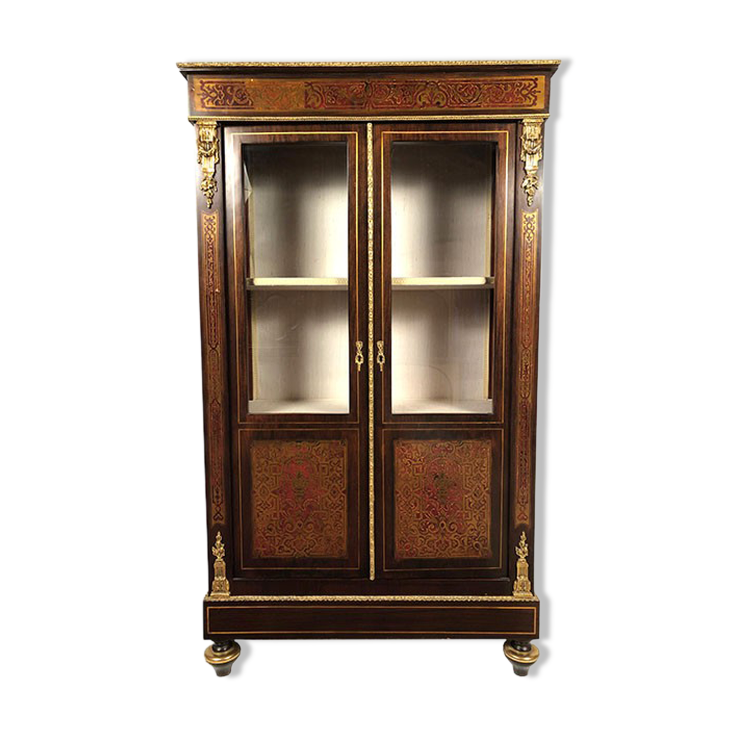 Varnished wood showcase and gold decoration in imitation of the so-called Boulle marquetry