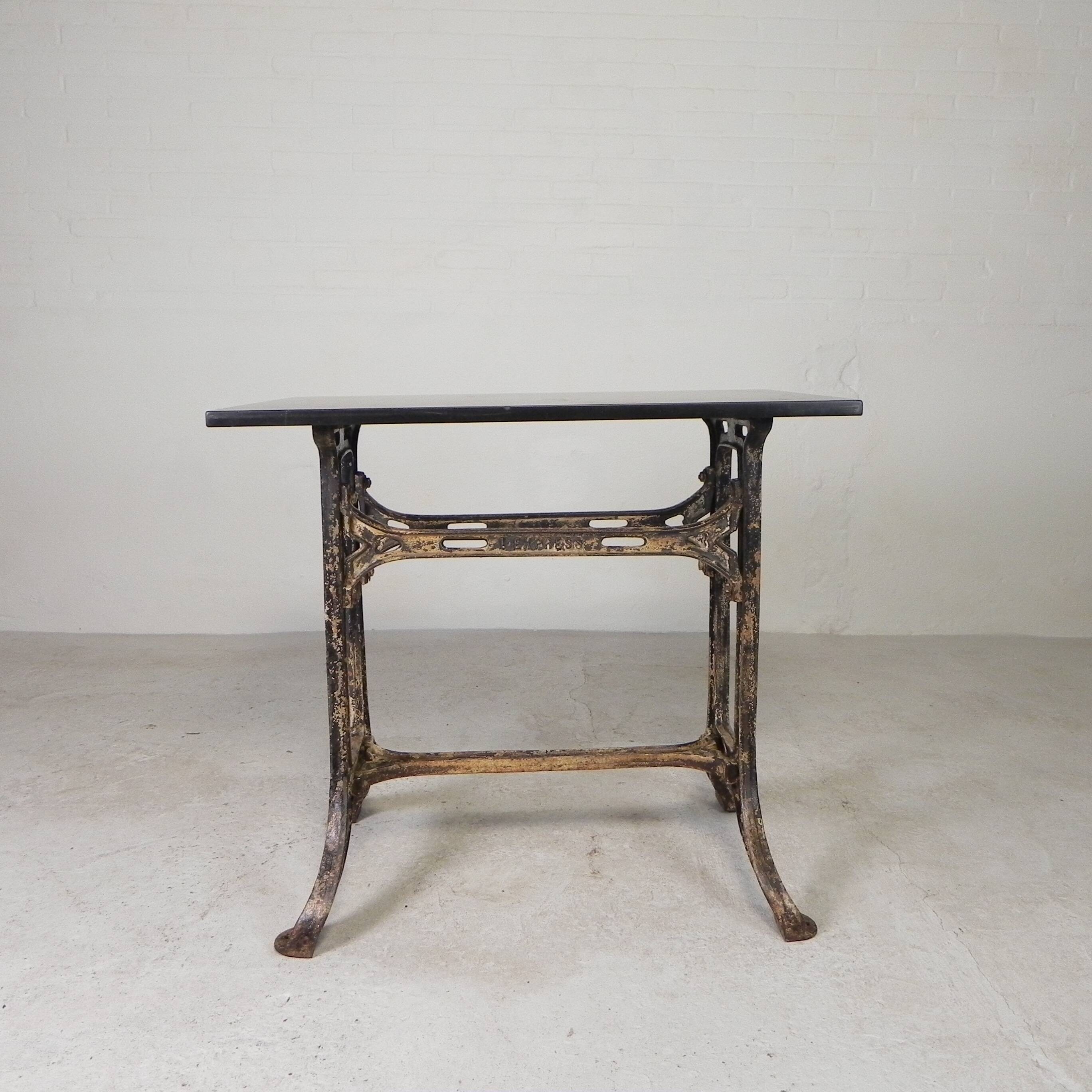 Industrial table, garden table with hard stone slab on cast iron frame, 1930s