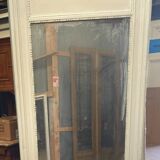 Louis XVI style mirror in wood and patinated stucco 20th century