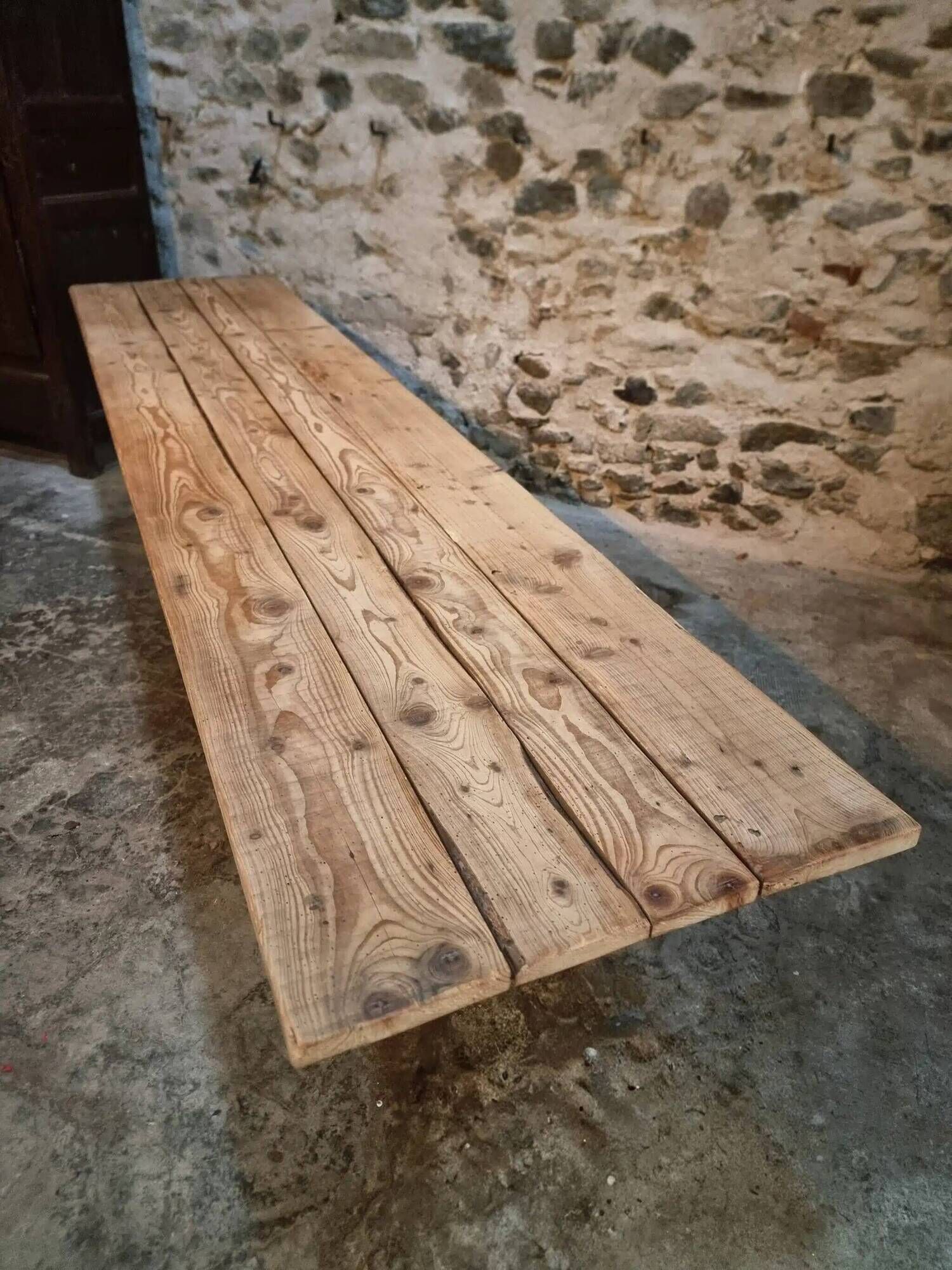 Old French industrial table with a cast iron base and a pine top.